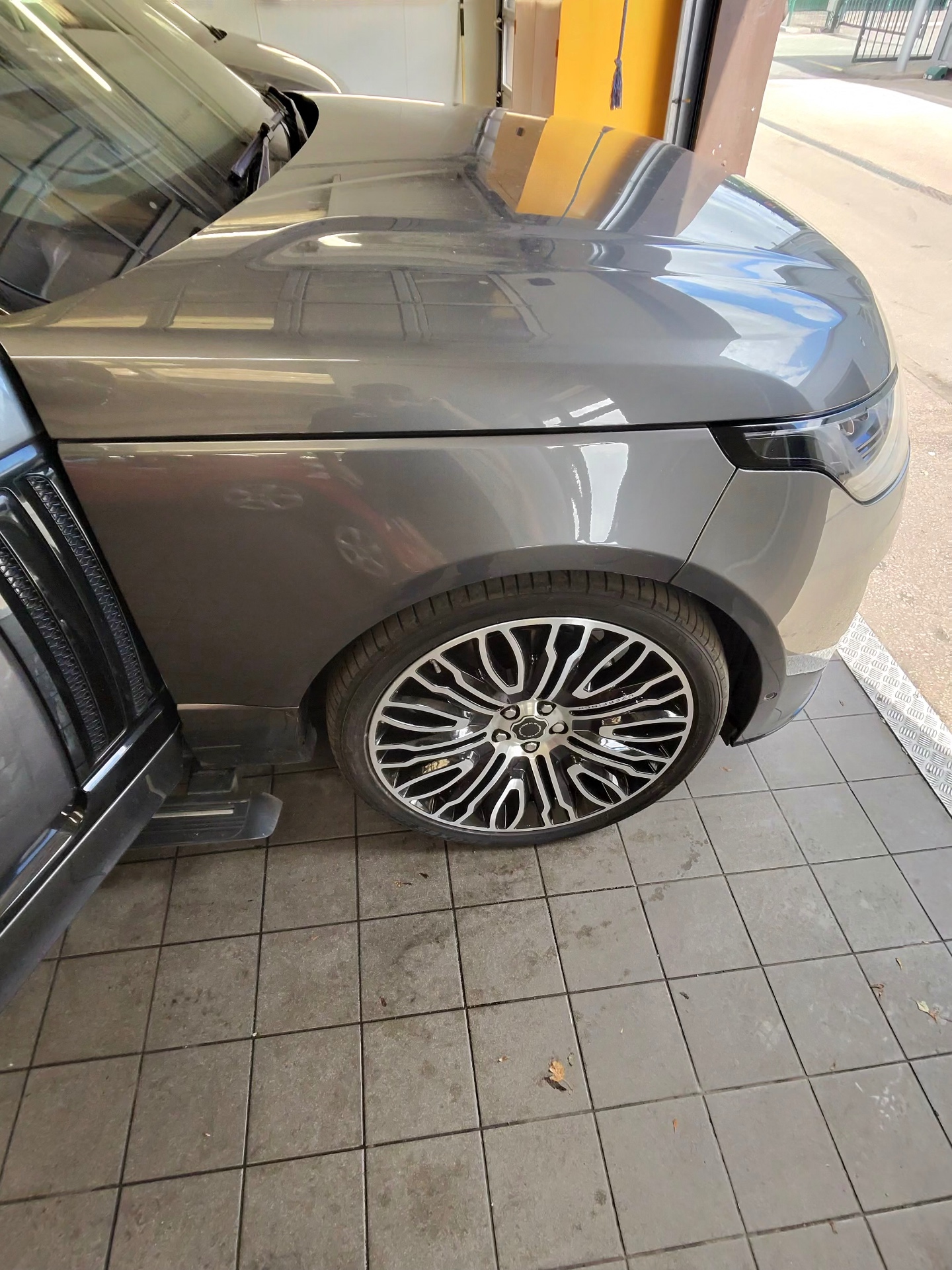 Grey Range Rover with a polished bonnet, wing and detailed alloy wheel
